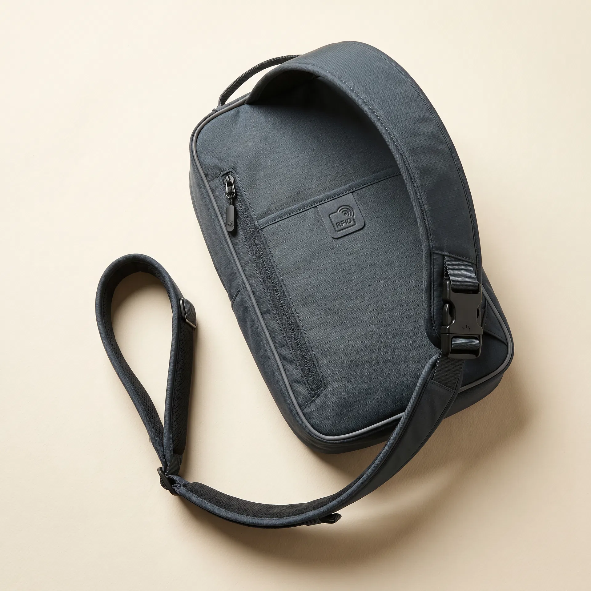 Anti-theft travel sling bag with RFID pocket